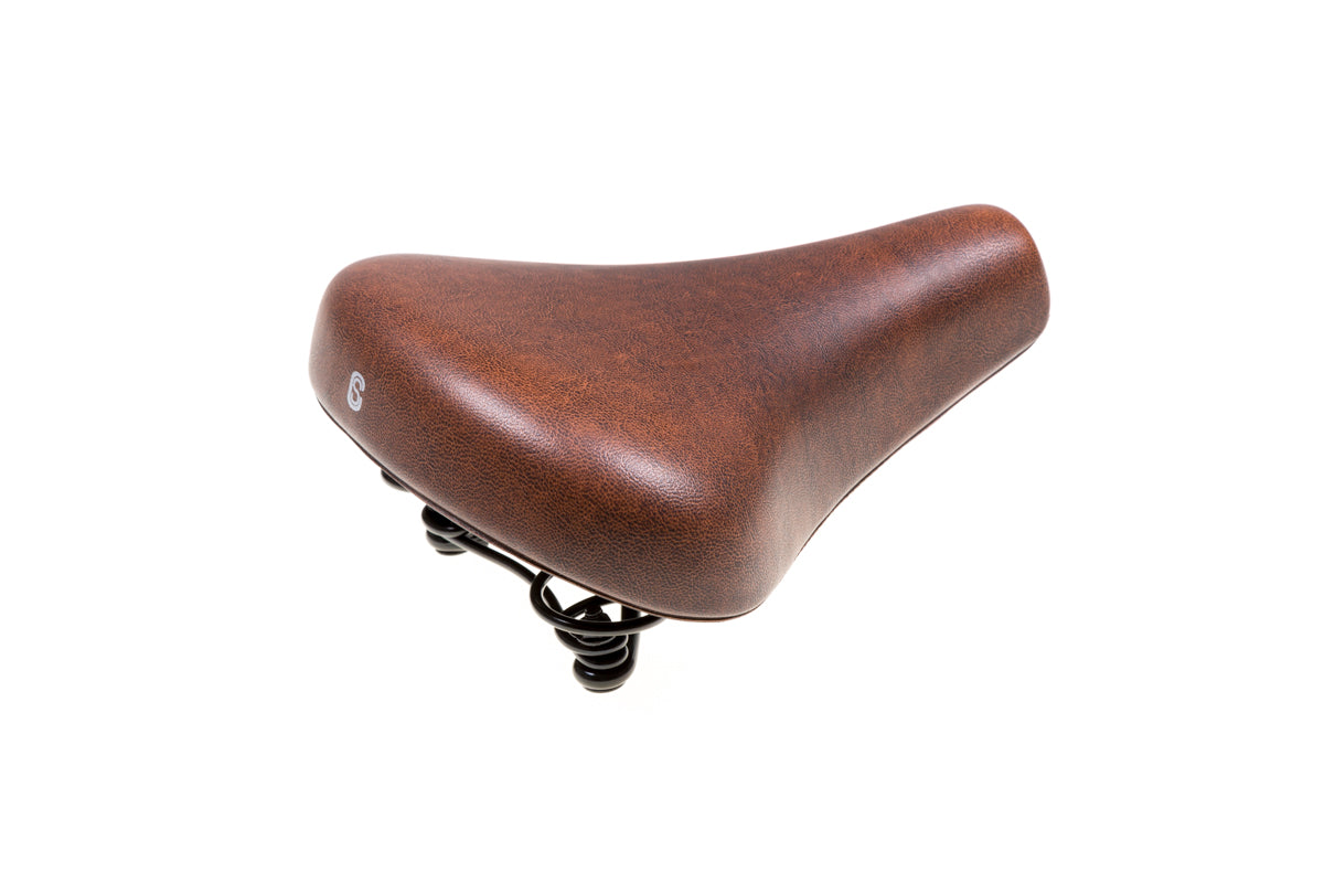 Selle confort selle city mousse marron. scellé sous vide, y compris la sangle