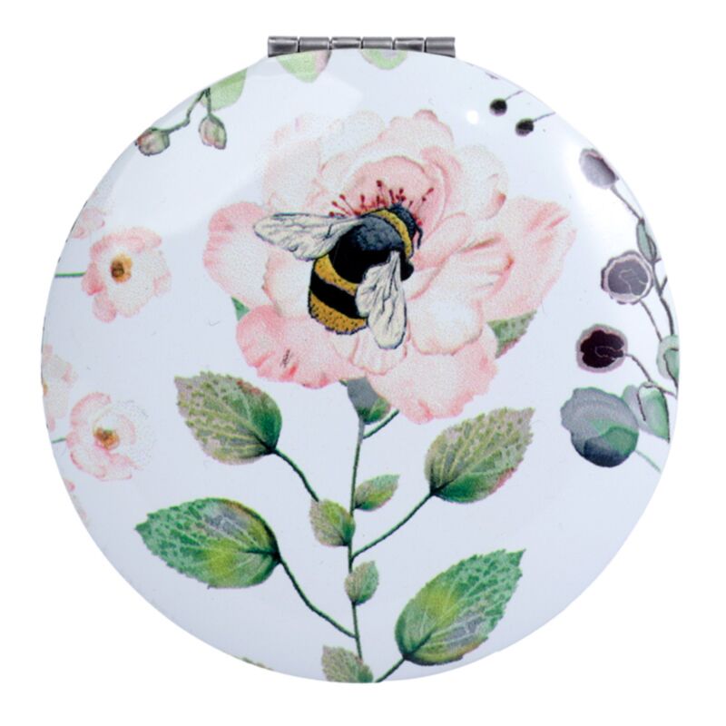 Prairies de nectar près d’un miroir de maquillage compact