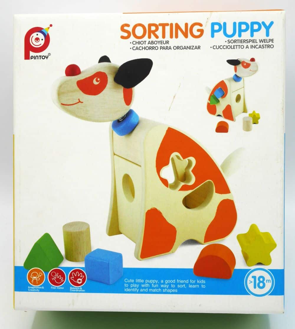 Puzzle en forme de chiot en bois avec 5 blocs différents.