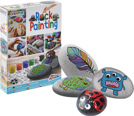 Peinture sur pierre de groupe d'artisanat créatif