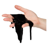 Toi-toys crazy slime slime noir dans un mini baril de pétrole