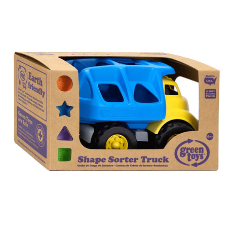 Des jouets verts forment un camion poubelle