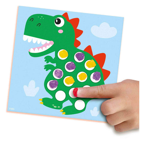 Ses premiers dinos de peinture d'empreintes digitales
