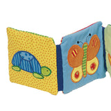 Livre en tissu Goki avec hochet, feuille froissée et couineur