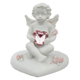 Paix du ciel coeur de la statue chérubin rose