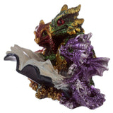 Lecture de bébé dragon triplet d'éléments