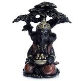 Ganesh en or noir assis sous un arbre